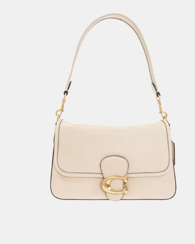 Coach Rogue bags with a monogram - embossed leather surfaceCOACH CREAM ‘SOFT TABBY’ SHOULDER BAG