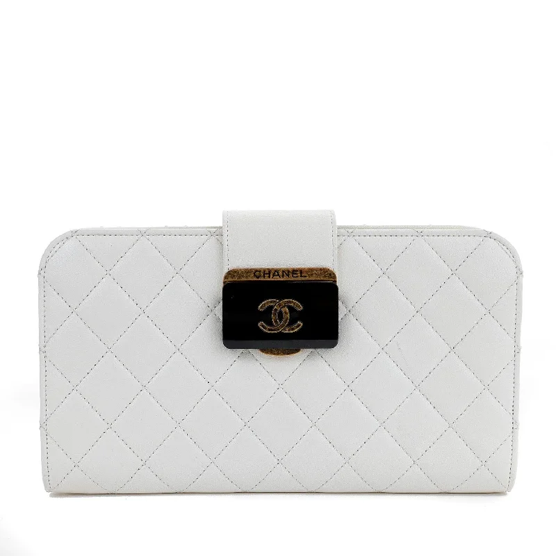 Chanel bags for those who value investment piecesChanel Ivory Lambskin Clutch w/ CC Enamel & Bronze Hardware