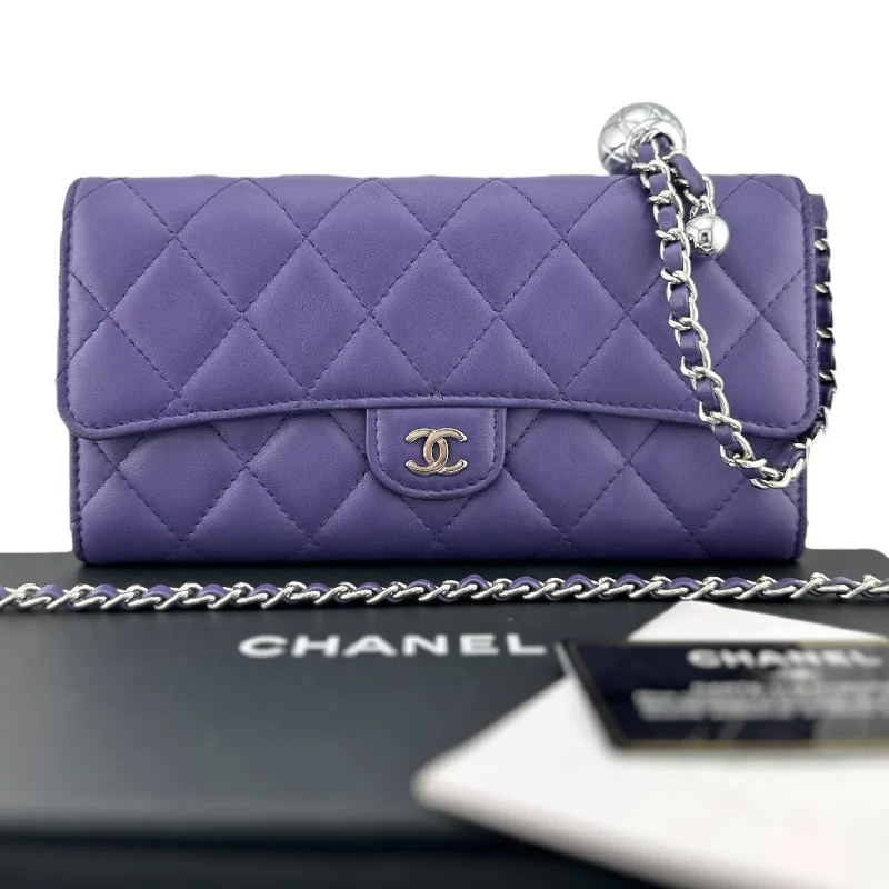 Chanel bags with exclusive seasonal designs and materialsCHANEL Purple Lambskin Classic Flap Gusseted Wallet