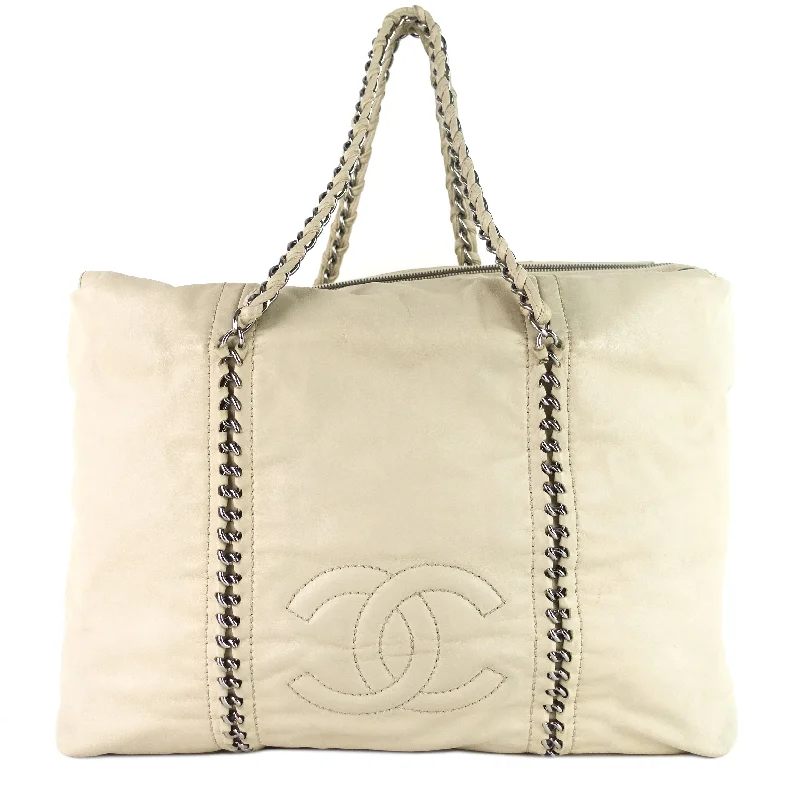 Chanel bags with chain and leather strap combinationsModern Chain Zip Leather Tote Bag