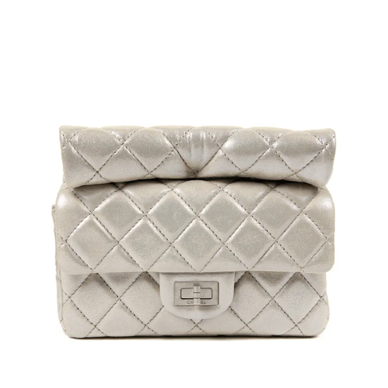 Chanel bags for those who value investment piecesChanel Silver Gold Leather Roll Handle Reissue Clutch