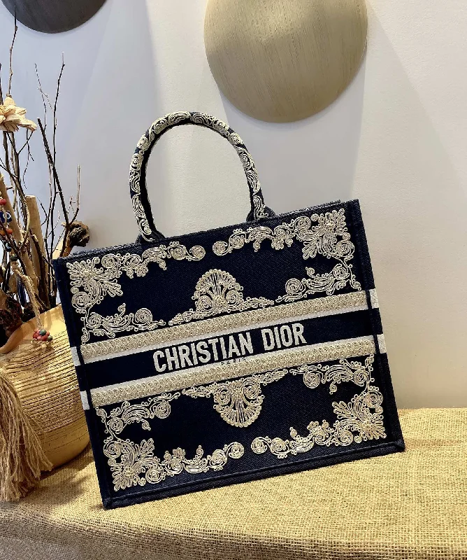 Christian Dior tote bags with a printed Dior logo on the frontChristian Dior Book Tote Bag