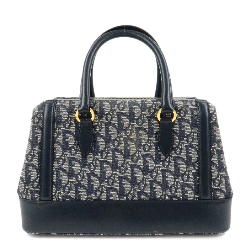 Christian Dior tote bags with a printed Dior logo on the frontChristian Dior Trotter Canvas Leather Boston Bag Navy White