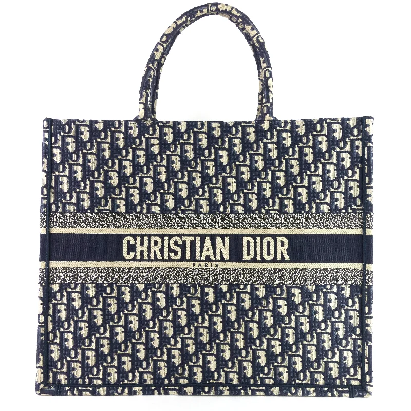 Christian Dior bags with a side - pocket for holding a water bottleOblique Canvas Book Tote Bag