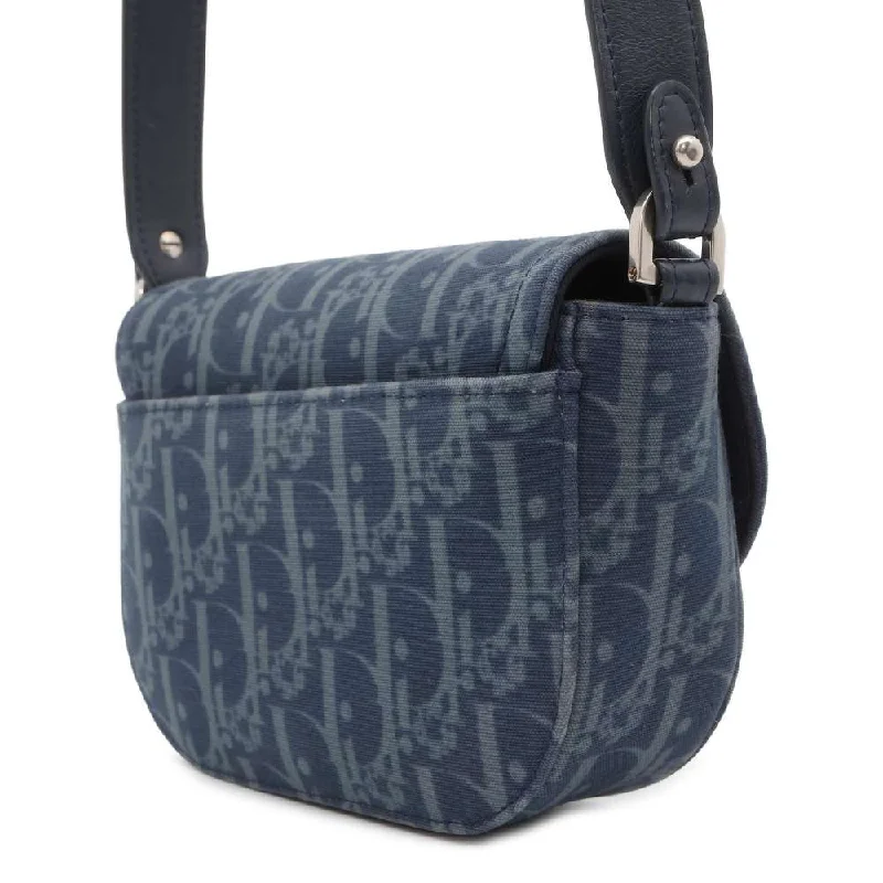 Christian Dior Saddle bags with a studded trim for a bold lookDior Oblique Saddle Shoulder Bag Tears Collection Navy 2ADCA435DDO CottonDenim Leather